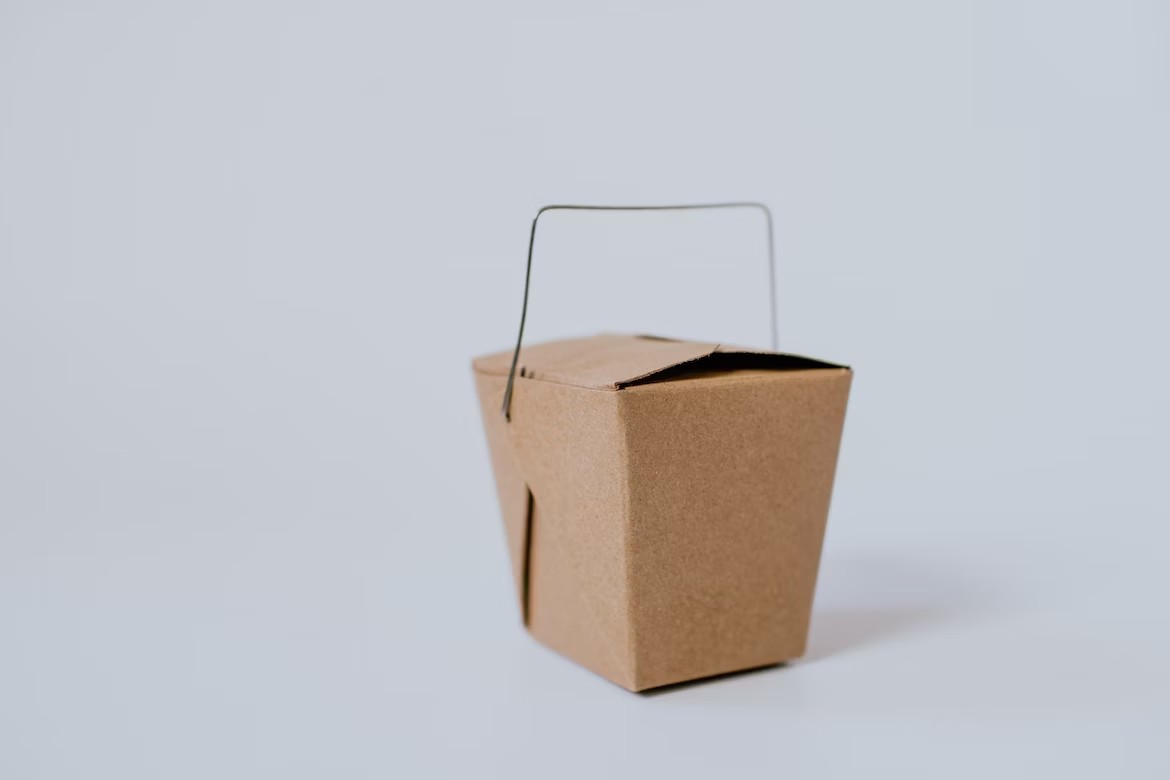 A takeout box made of paper.